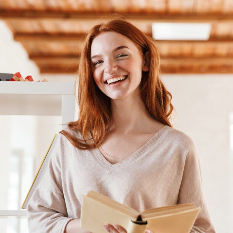 happy-redhead-young-lady-student-reading-book-M5Z7RVC@2x-1.jpg